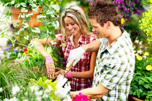 Safety-focused gardening team planning outdoor maintenance work